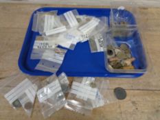 A tray of metal detector finds including coins, cart wheel pennies,