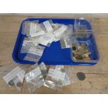 A tray of metal detector finds including coins, cart wheel pennies,