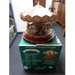 A boxed Mr Christmas electric marquee grand carousel with certificate CONDITION REPORT: