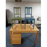 A contemporary pine effect office table fitted a drawer together with three drawer under desk