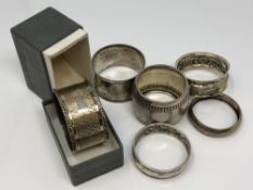 Six silver napkin rings,