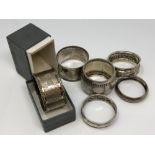 Six silver napkin rings,