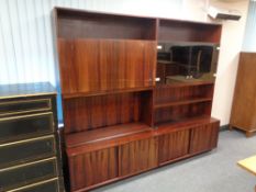 A mid century Danish twin section bookcase fitted with cupboards