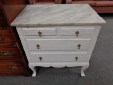 A twentieth century painted four drawer marble topped chest
