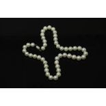A cultured pearl necklace with sterling silver clasp, length 42 cm.