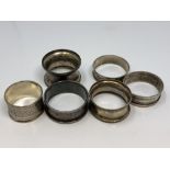 Six assorted silver napkin rings CONDITION REPORT: 77.