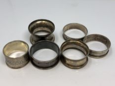 Six assorted silver napkin rings CONDITION REPORT: 77.