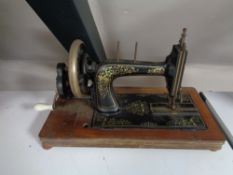 An early twentieth century hand sewing machine