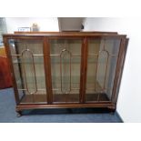 An Edwardian mahogany triple door display cabinet on Queen Anne style legs