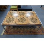 A twentieth century Danish tiled coffee table on metal legs