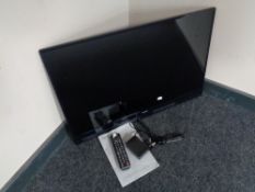 A Samsung 32 inch LED TV with lead and remote (no stand)