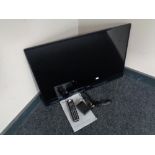 A Samsung 32 inch LED TV with lead and remote (no stand)