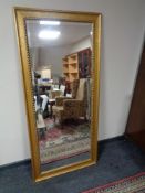 A large gilt framed bevelled hall mirror
