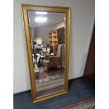 A large gilt framed bevelled hall mirror