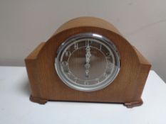 An oak cased Enfield mantel clock