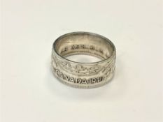 A Canadian half dollar 1940 ring,