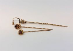 Three antique gold pins, one modelled as a snake,