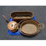 A tray of antique copper ware including lidded pan,