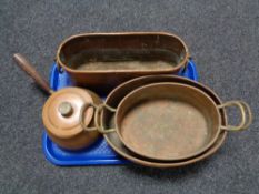 A tray of antique copper ware including lidded pan,