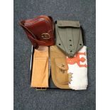 A tray of leather cartridge bag, leather holster, military shovel,