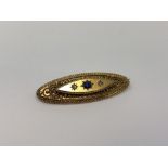 An antique 15ct gold sapphire and diamond brooch