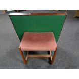 A mid century teak dressing table stool upholstered in pink dralon and folding card table