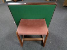 A mid century teak dressing table stool upholstered in pink dralon and folding card table