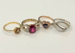 Four white metal dress rings