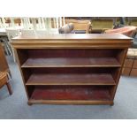 A set of twentieth century mahogany open bookshelves