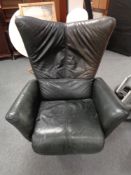 A late twentieth century high backed black leather adjustable chair on swivel base