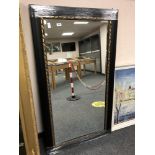 A black framed mirror