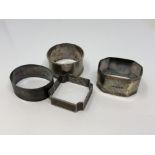 Four assorted silver napkin rings CONDITION REPORT: 73.