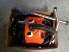 A Henry vacuum with tools