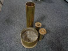 Four brass ammunition shells (Two in the form of candlesticks)