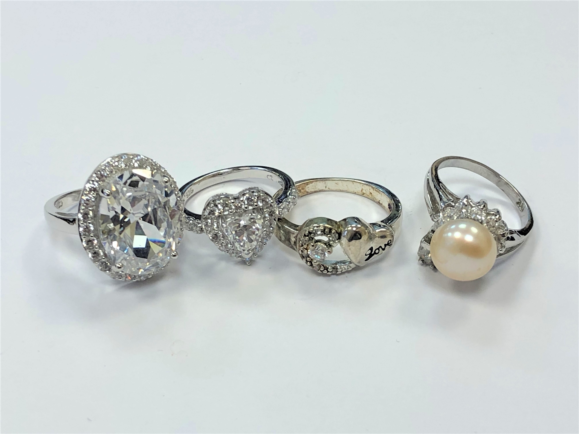 Four white metal dress rings - Image 2 of 2