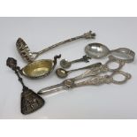 A group of silver and other items including caddy spoon, strainer, salt,