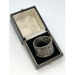 An ornate Victorian silver napkin ring, William Hutton & Sons,