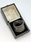 An ornate Victorian silver napkin ring, William Hutton & Sons,