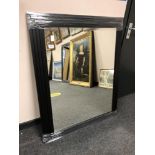 A black framed contemporary mirror