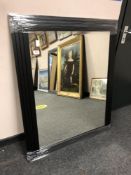 A black framed contemporary mirror