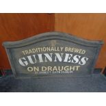 A hand painted chalk board with Guiness advertising