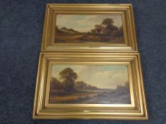 A pair of antiquarian gilt framed oils on canvas of rural landscapes in gilt moulded frames.