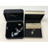 A Diamonfire silver pendant and matching earrings in box,