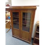 A twentieth century mahogany double door bookcase