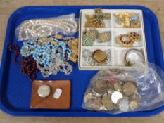 A tray of assorted costume jewellery, beaded necklaces,