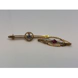 A gold sapphire and diamond brooch and a gold garnet and pearl brooch