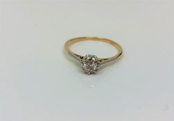 An 18ct gold solitaire diamond ring, approximately 0.