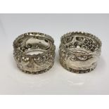 A pair of ornate silver napkin rings, Charles Horner,