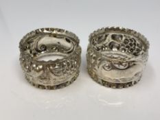 A pair of ornate silver napkin rings, Charles Horner,