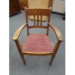 An early twentieth century oak armchair